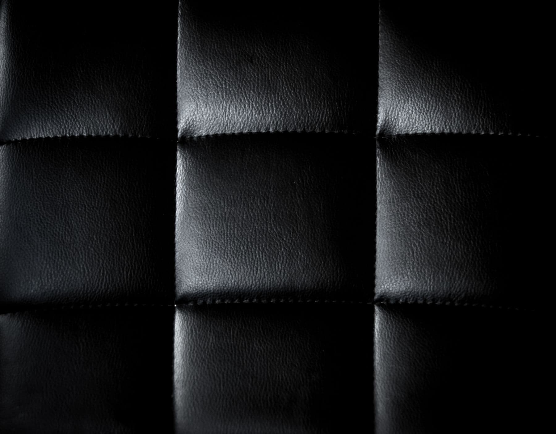 Close-up of quilted leather car upholstery